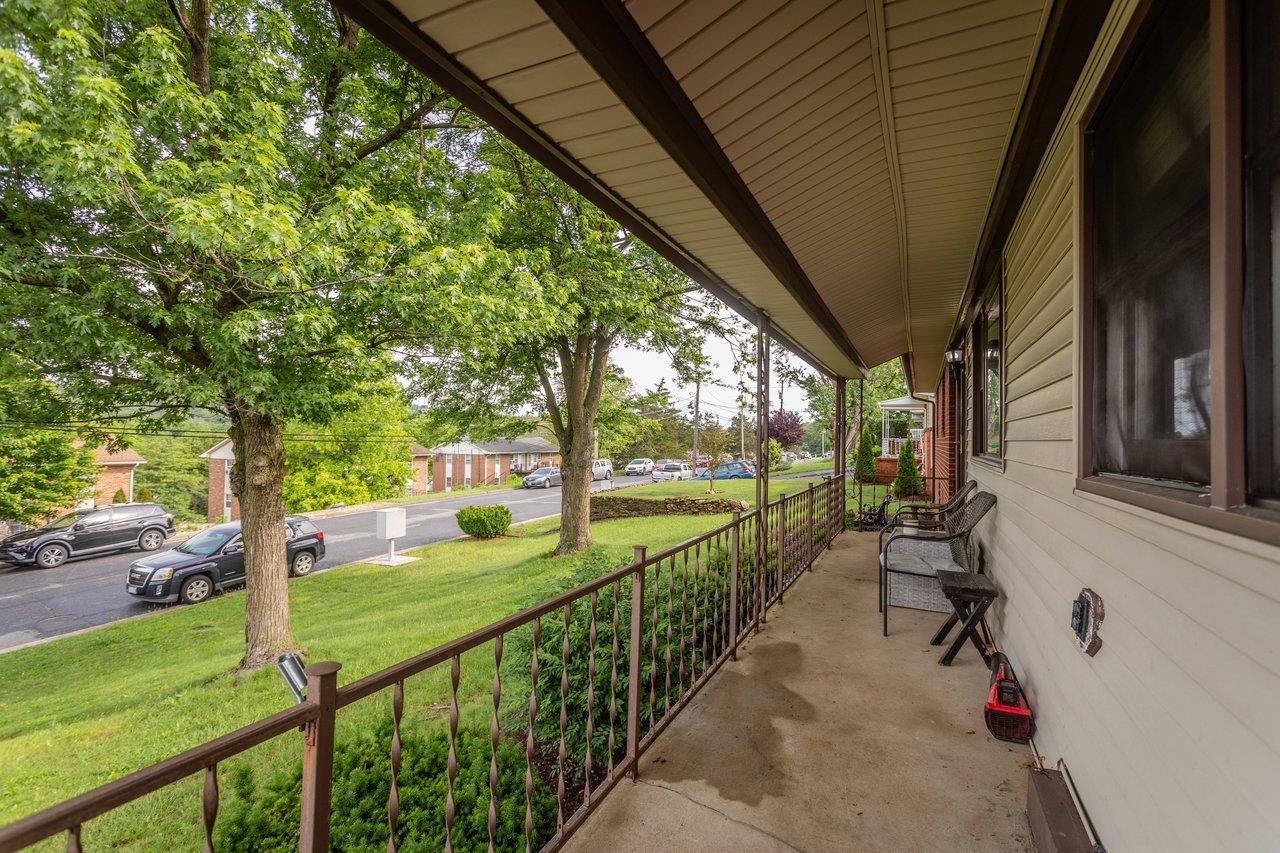 220 Rockingham Drive Harrisonburg, VA 22802 - Photo 2 of 40 a view of a porch with chairs and backyard