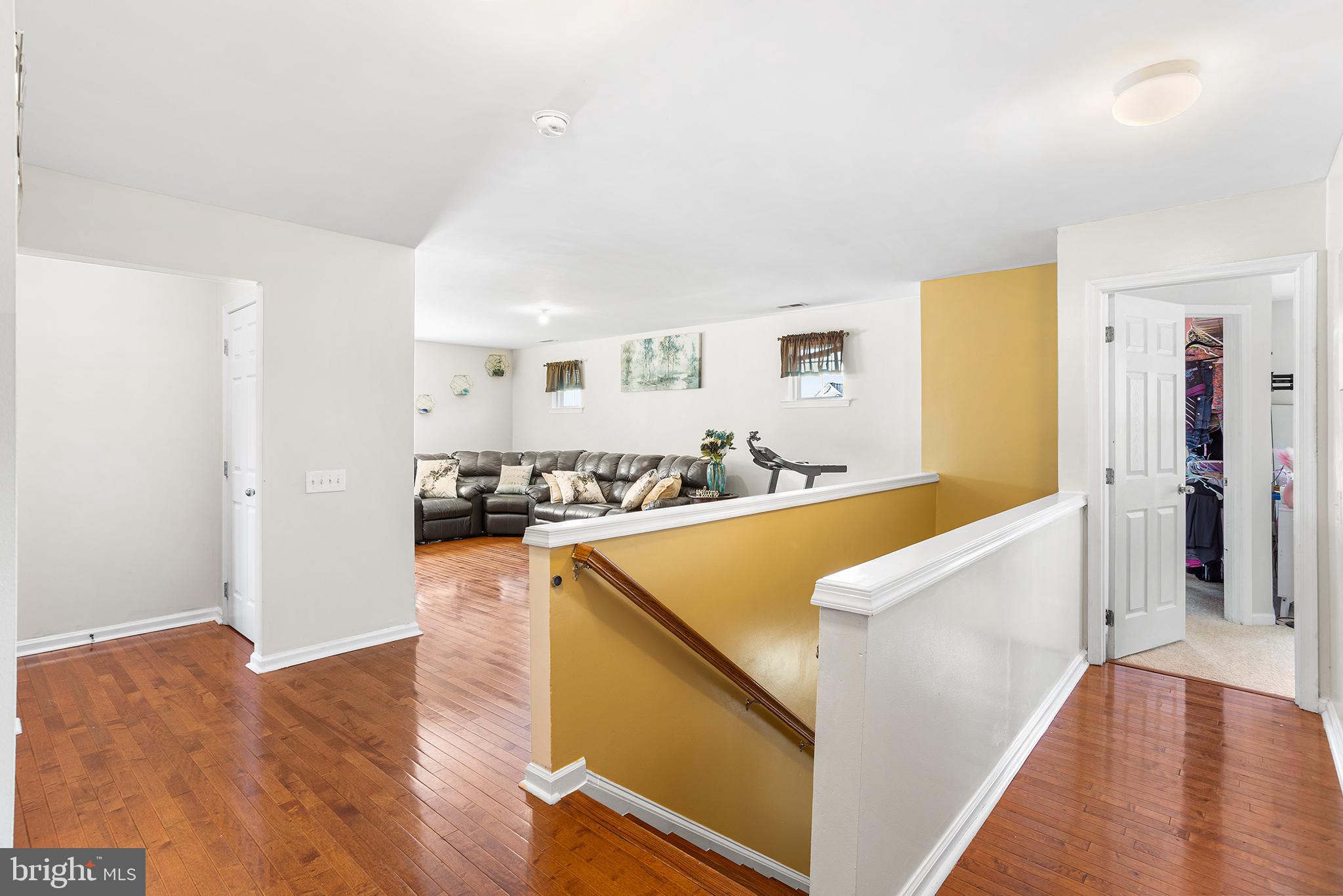 323 Pigott Drive Florence, NJ 08518 - Photo 14 of 36 a view of a living room with kitchen island and wooden floor