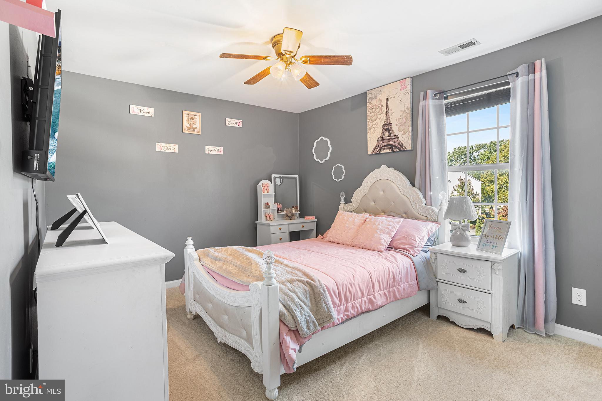 323 Pigott Drive Florence, NJ 08518 - Photo 19 of 36 a bedroom with a bed and a chandelier