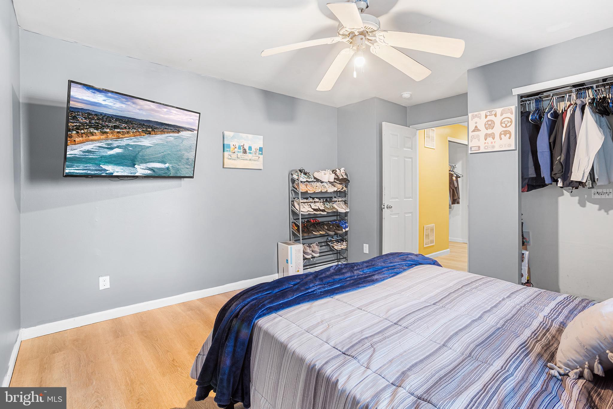 323 Pigott Drive Florence, NJ 08518 - Photo 31 of 36 a bedroom with a bed and a painting on the wall