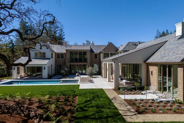 a view of a house with outdoor seating area