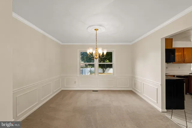 a view of room with window and furniture