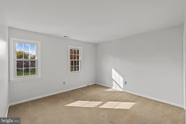 a bathroom with a sink toilet and mirror