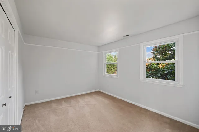 a view of a room with wooden walls