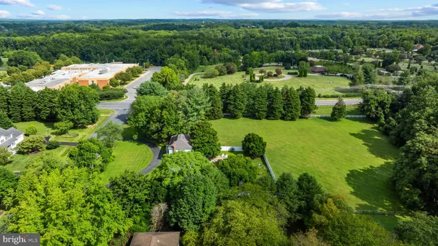 a view of a garden with a building in the background