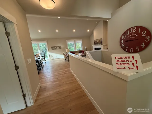 a view of a kitchen with furniture and wooden floor