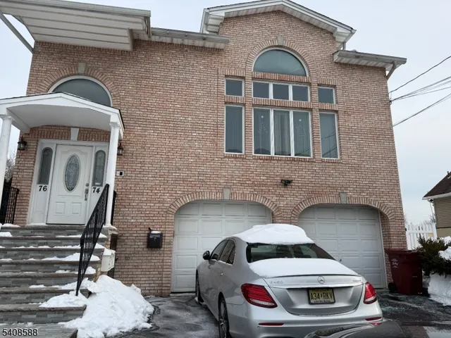 a front view of a house with parking space