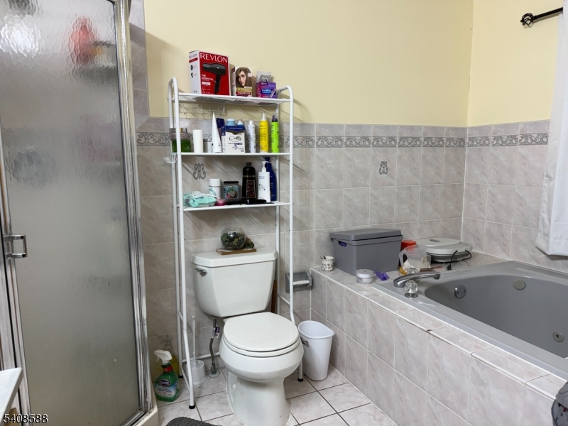 76 Passaic Avenue, Unit 76 Nutley, NJ 07110 - Photo 11 of 15 a bathroom with a toilet and a sink
