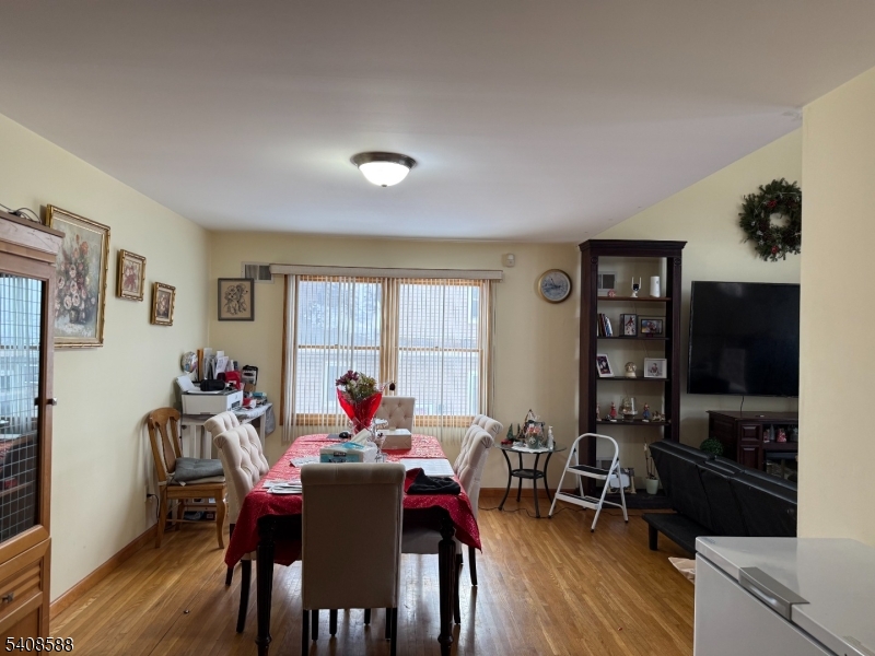 76 Passaic Avenue, Unit 76 Nutley, NJ 07110 - Photo 13 of 15 a view of a dining room with furniture and wooden floor