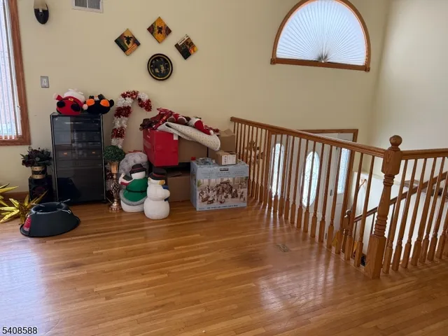 a group of people sitting on a floor in a room
