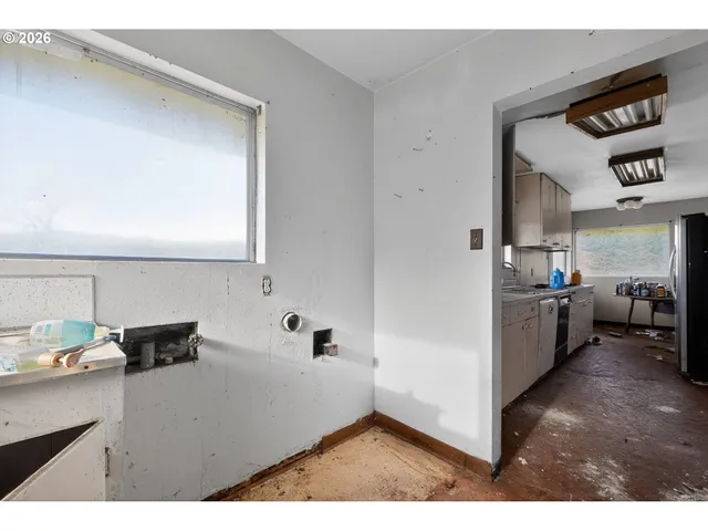 a kitchen view with cabinets a sink and a stove
