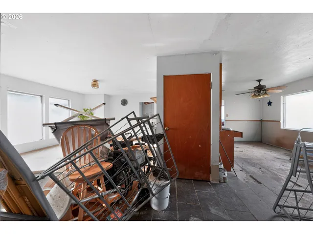 a view of a livingroom with furniture and hardwood floor