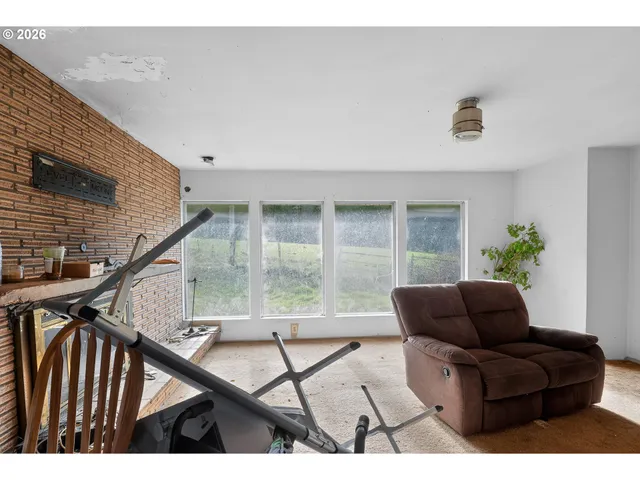 a living room with furniture and white walls
