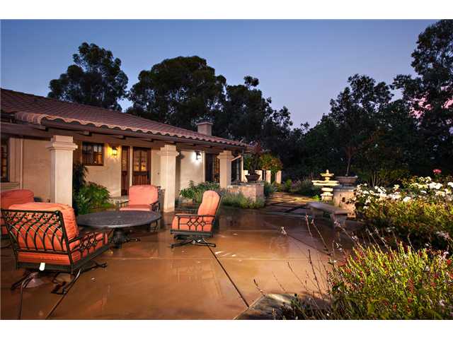 188 Candy Lane Encinitas, CA 92024 - Photo 2 of 25 Front entry courtyard with seating area, flowers and fountain.