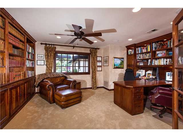 188 Candy Lane Encinitas, CA 92024 - Photo 11 of 25 Den/Office with extensive built-in bookcases, desk and storage, ceiling fan and recessed lighting.