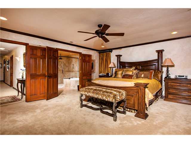 188 Candy Lane Encinitas, CA 92024 - Photo 13 of 25 Master bedroom with double door entry, ceiling fan, recessed lighting, speakers and his & her walk-in closets with custom cabinetry.
