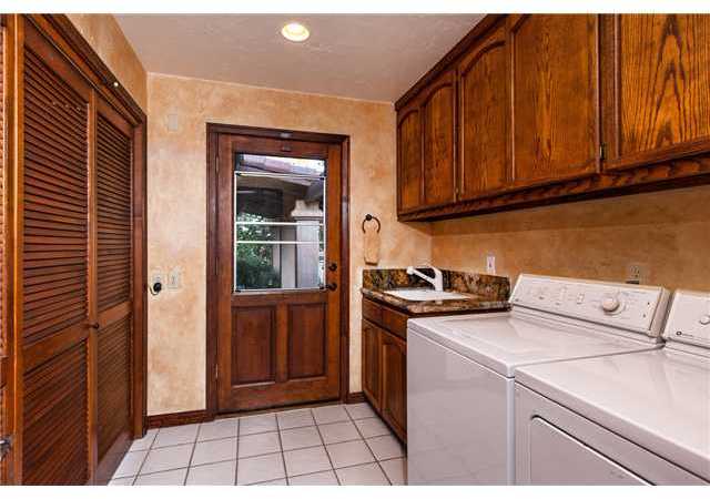 188 Candy Lane Encinitas, CA 92024 - Photo 18 of 25 Laundry room opens to the outside, sink, storage cabinets, recessed lighting.