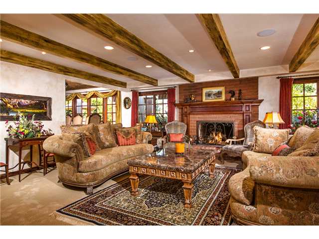 188 Candy Lane Encinitas, CA 92024 - Photo 6 of 25 Formal living room with beam ceiling, gas fireplace, built-in speakers, recessed lighting, faux finish walls and divided light windows.
