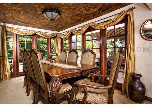 188 Candy Lane Encinitas, CA 92024 - Photo 7 of 25 Formal dining room with gold leaf ceiling treatment and multiple french doors which open out to the patio for entertaining.