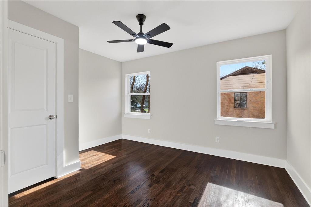 806 Denton Street Denton, TX 76201 - Photo 11 of 19 Spare room with dark wood-style flooring and a ceiling fan