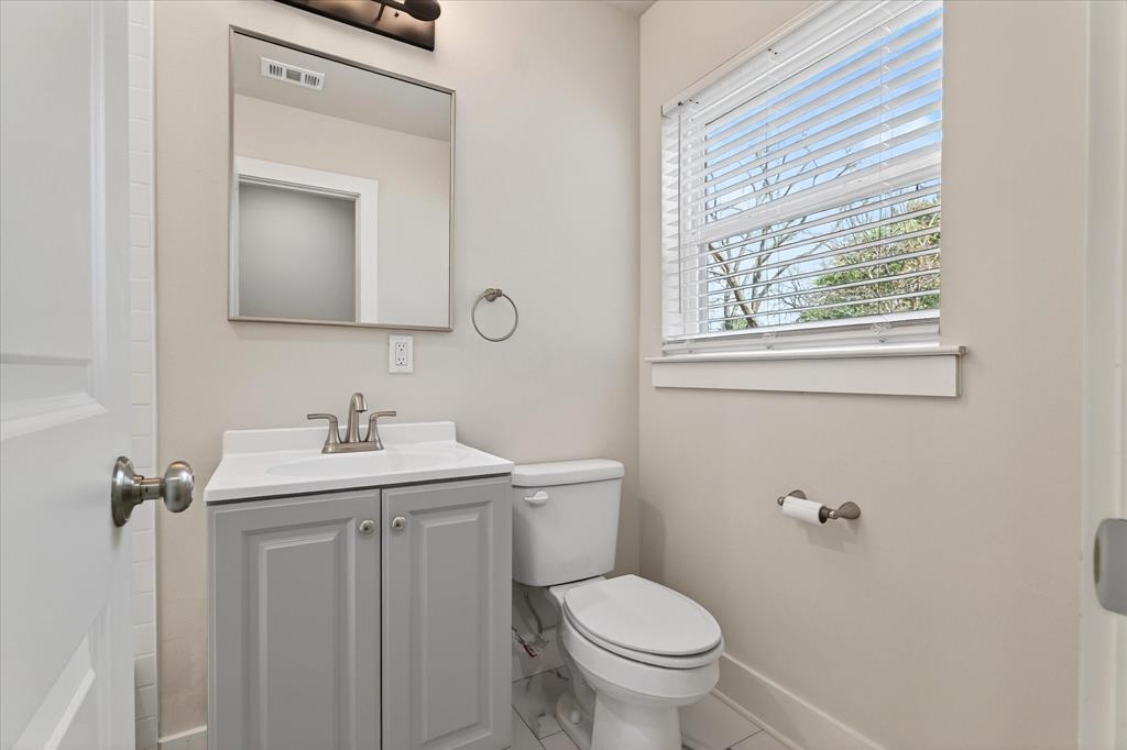 806 Denton Street Denton, TX 76201 - Photo 12 of 19 Bathroom featuring vanity and toilet