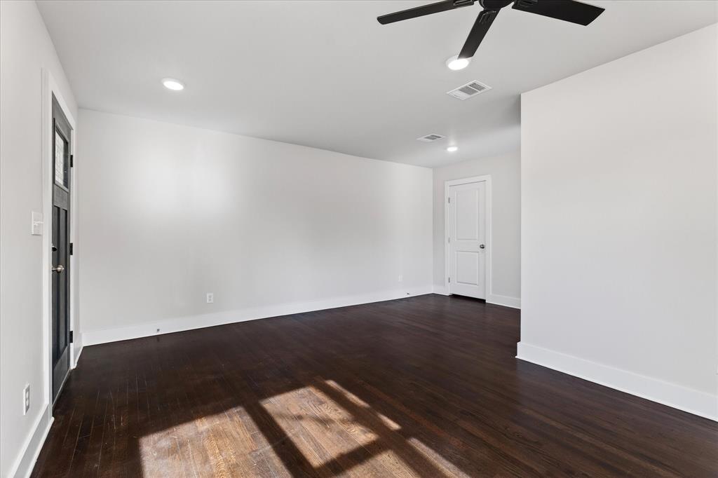 806 Denton Street Denton, TX 76201 - Photo 5 of 19 Unfurnished room featuring dark wood-style flooring, recessed lighting, and ceiling fan