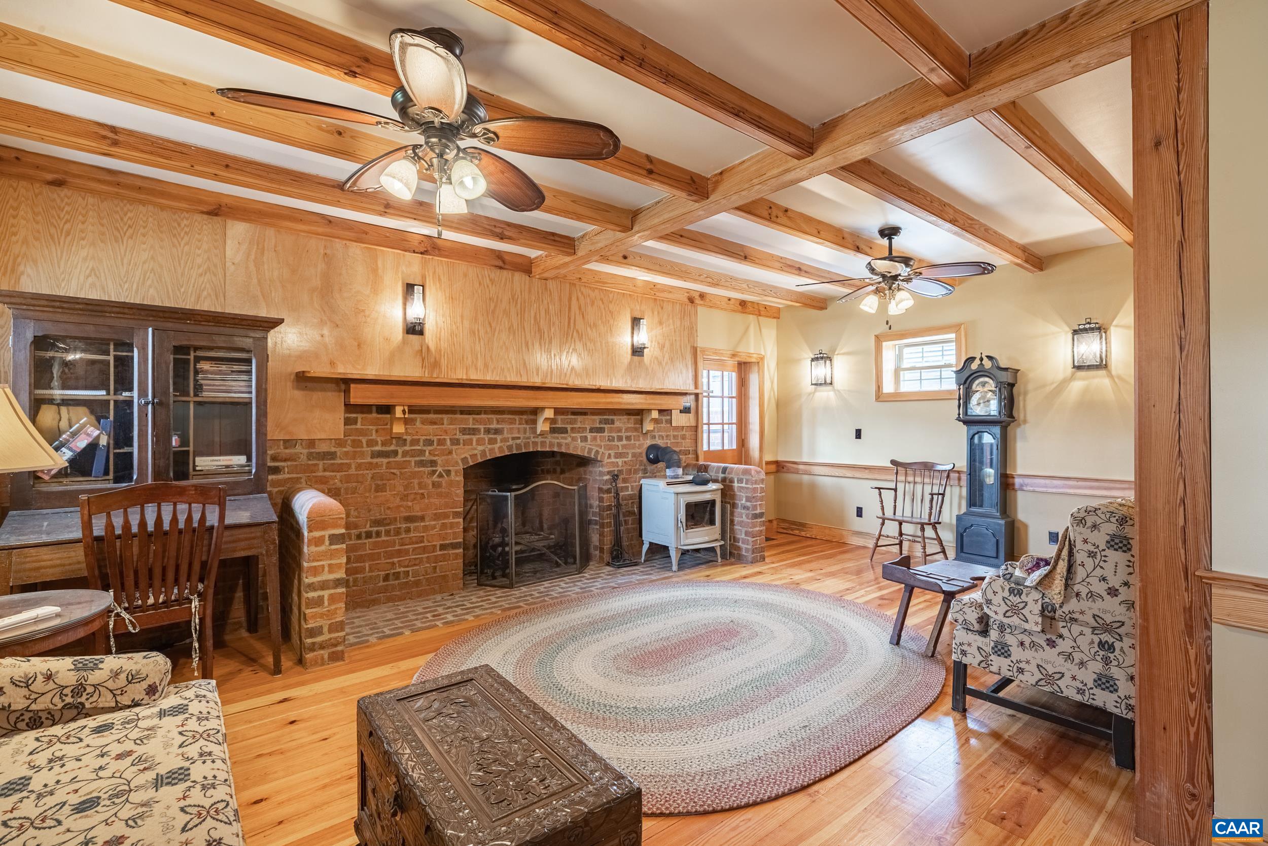 3100 Bacon School Road Saxe, VA 23967 - Photo 11 of 47 a living room with furniture and a fireplace