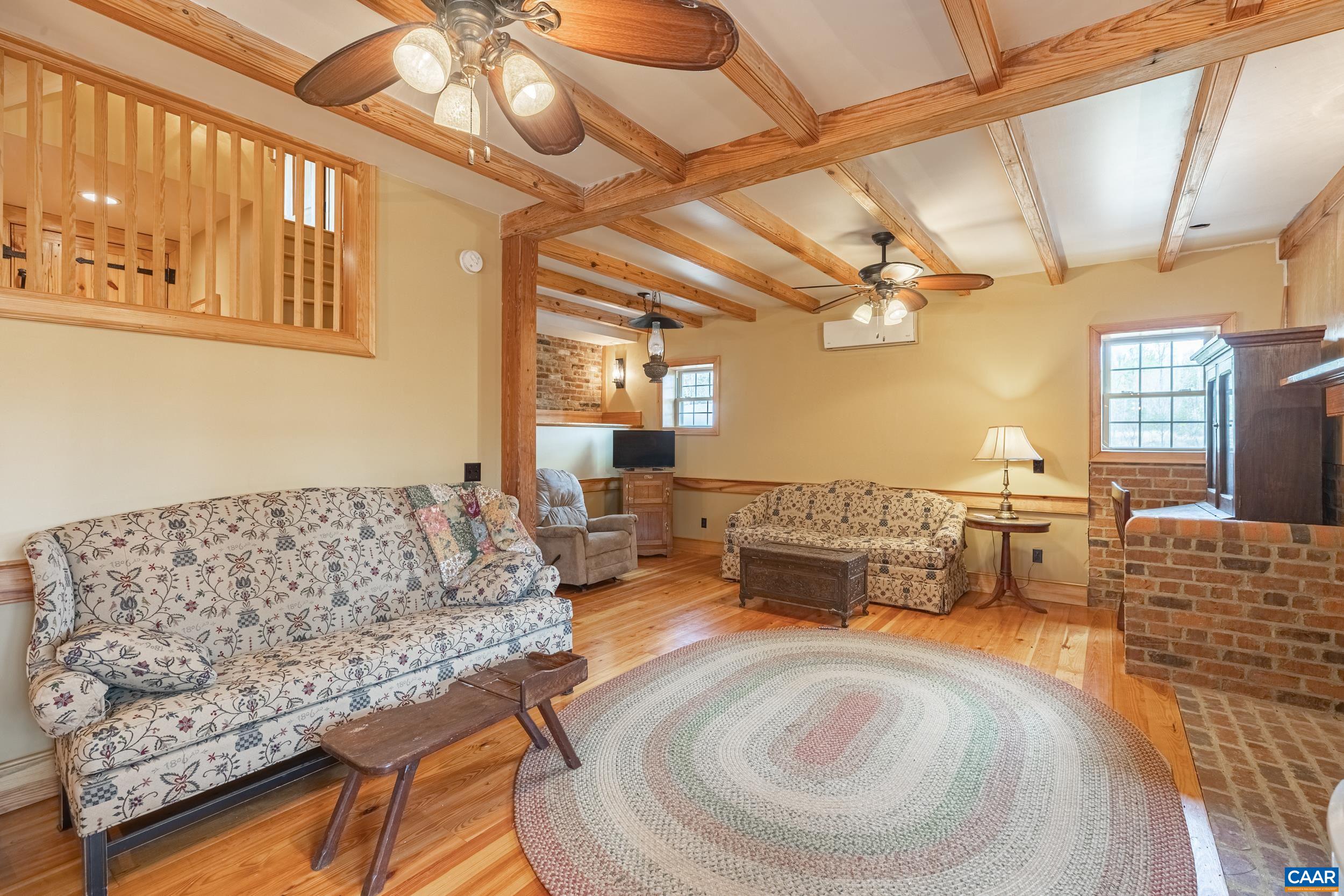 3100 Bacon School Road Saxe, VA 23967 - Photo 12 of 47 a living room with furniture and a chandelier