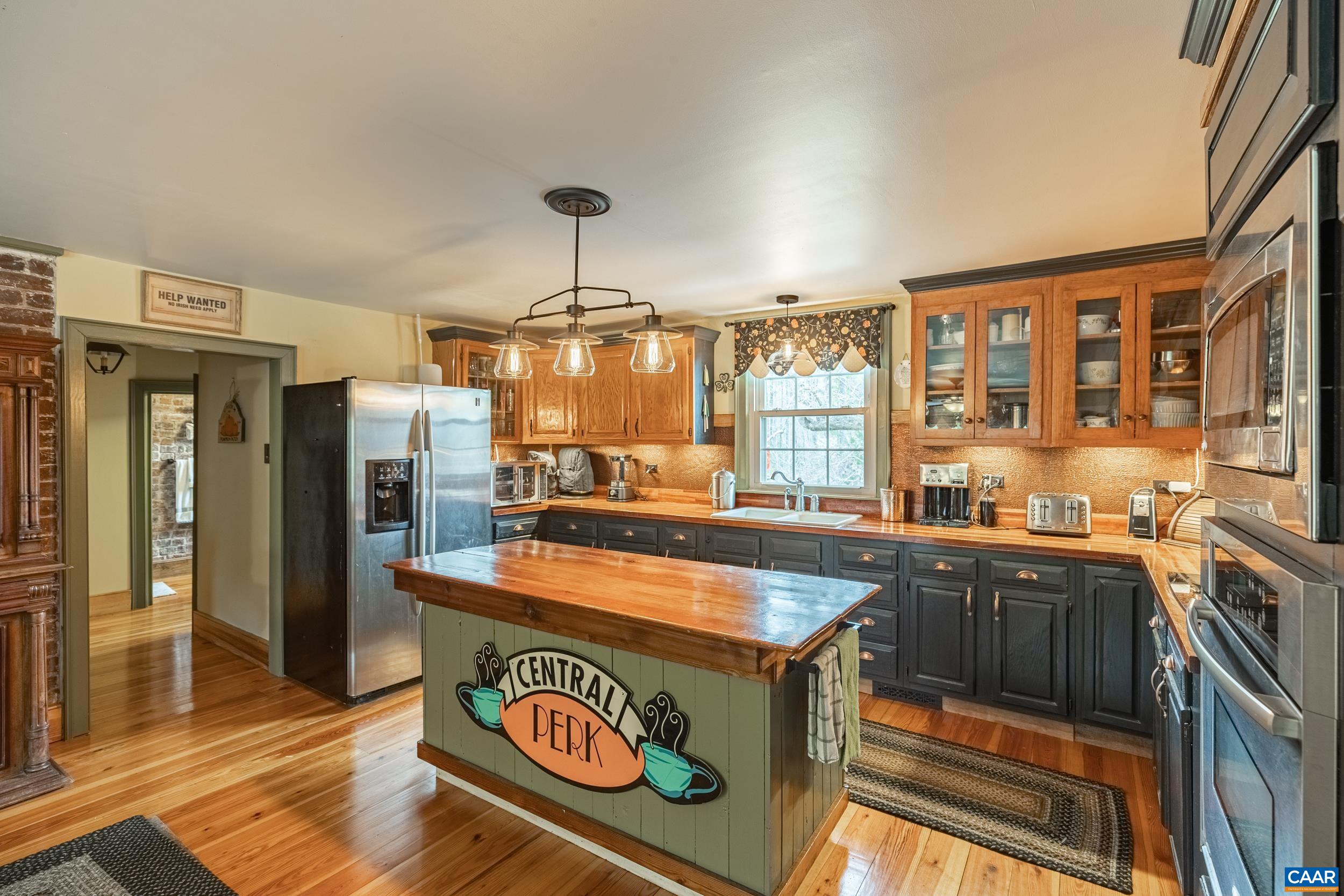 3100 Bacon School Road Saxe, VA 23967 - Photo 14 of 47 a kitchen with kitchen island granite countertop a stove and a sink