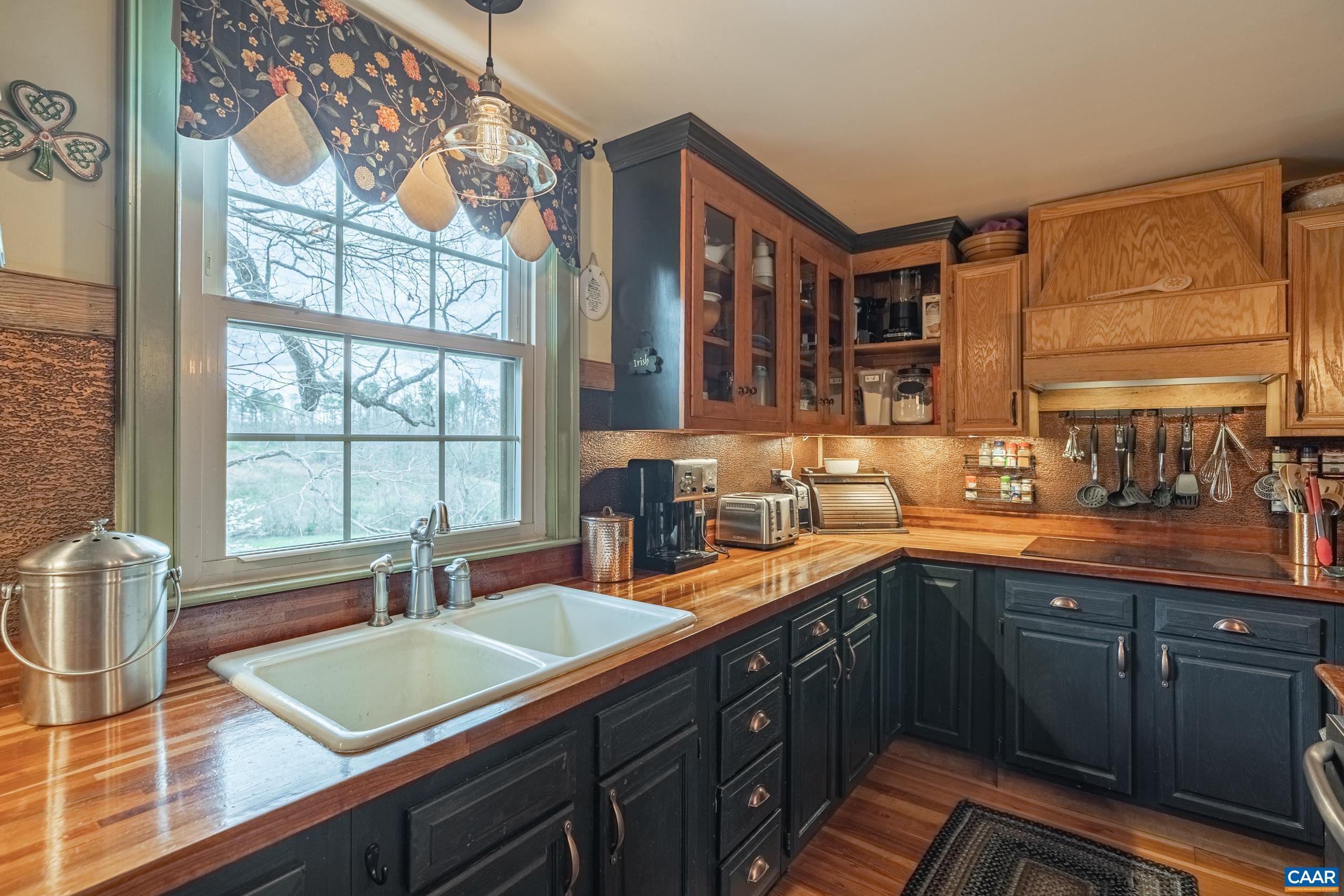 3100 Bacon School Road Saxe, VA 23967 - Photo 15 of 47 a kitchen with a sink stove and cabinets
