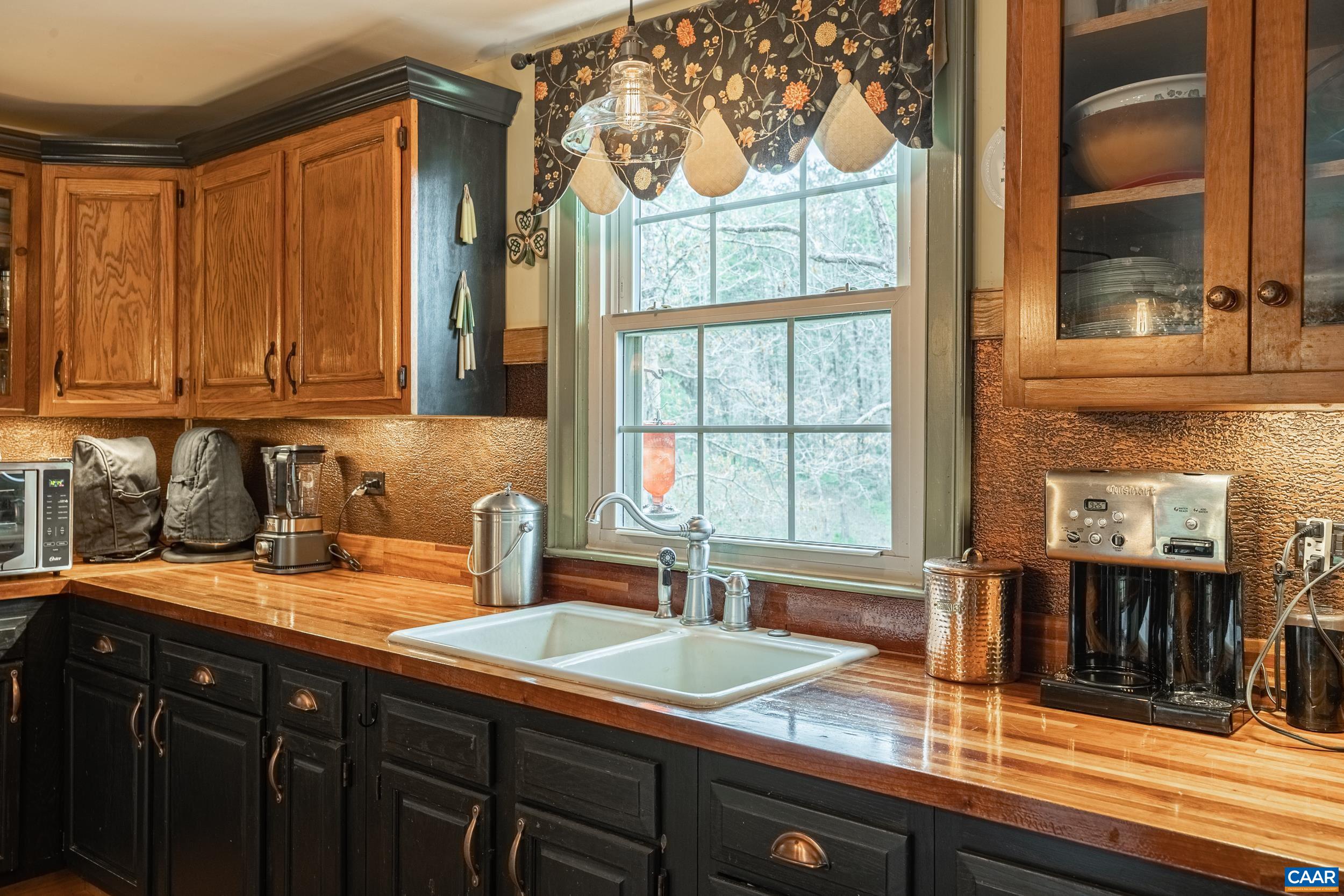 3100 Bacon School Road Saxe, VA 23967 - Photo 16 of 47 a kitchen with stainless steel appliances granite countertop a sink and a cabinets