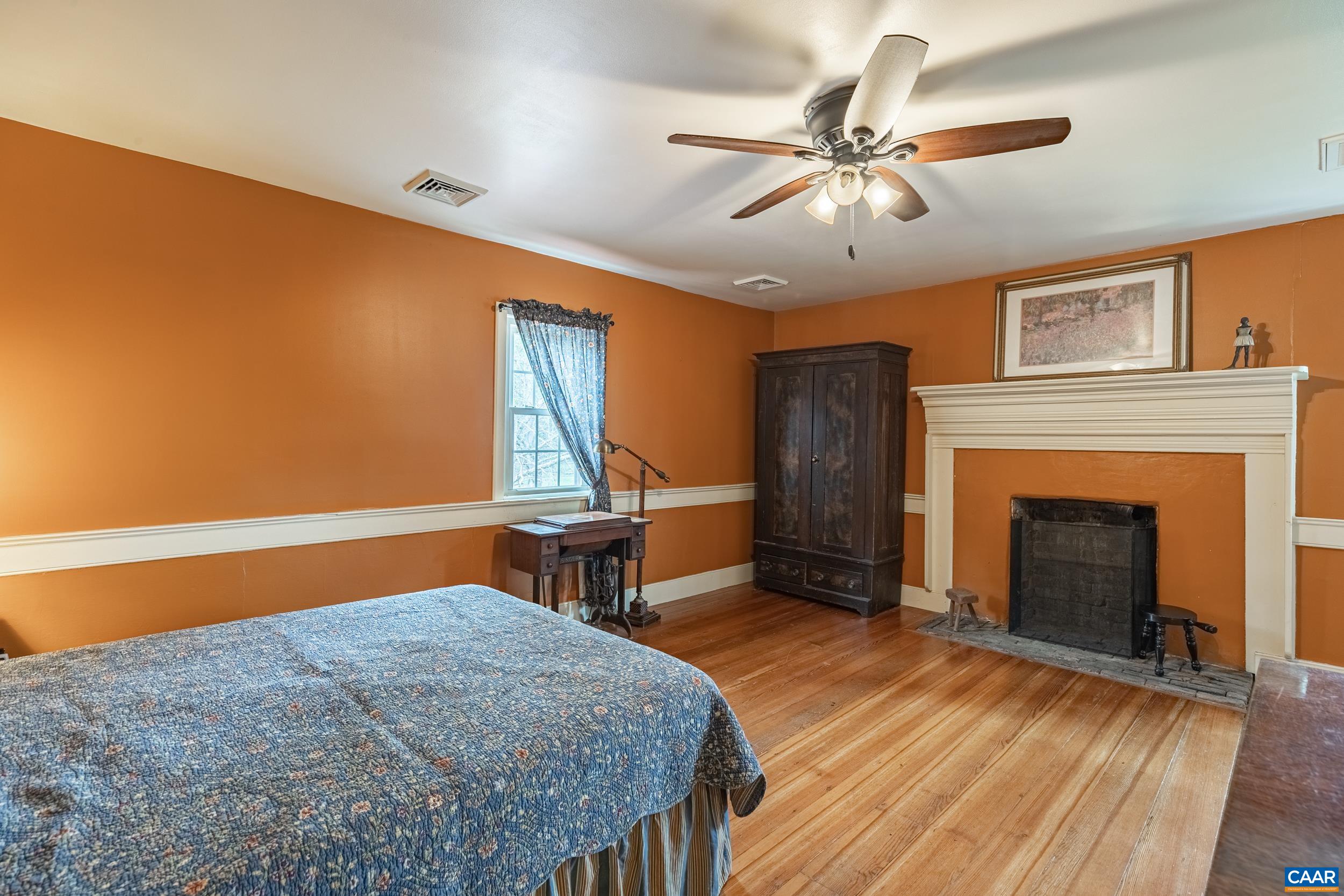 3100 Bacon School Road Saxe, VA 23967 - Photo 26 of 47 a bedroom with furniture and a fireplace