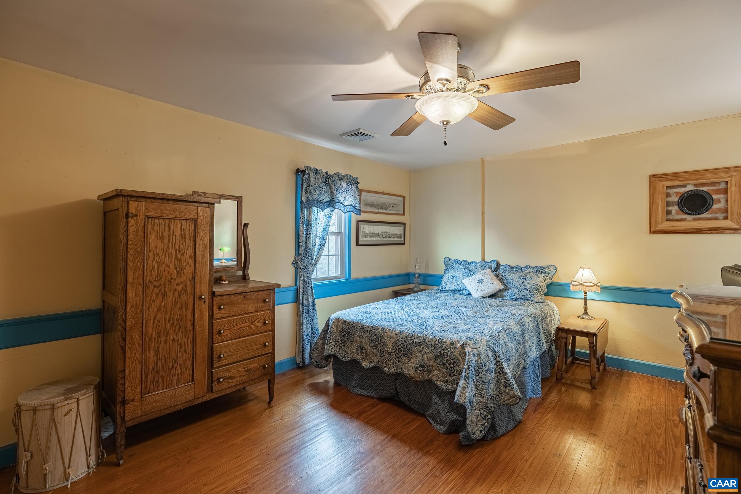3100 Bacon School Road Saxe, VA 23967 - Photo 27 of 47 a bedroom with a bed and wooden floor
