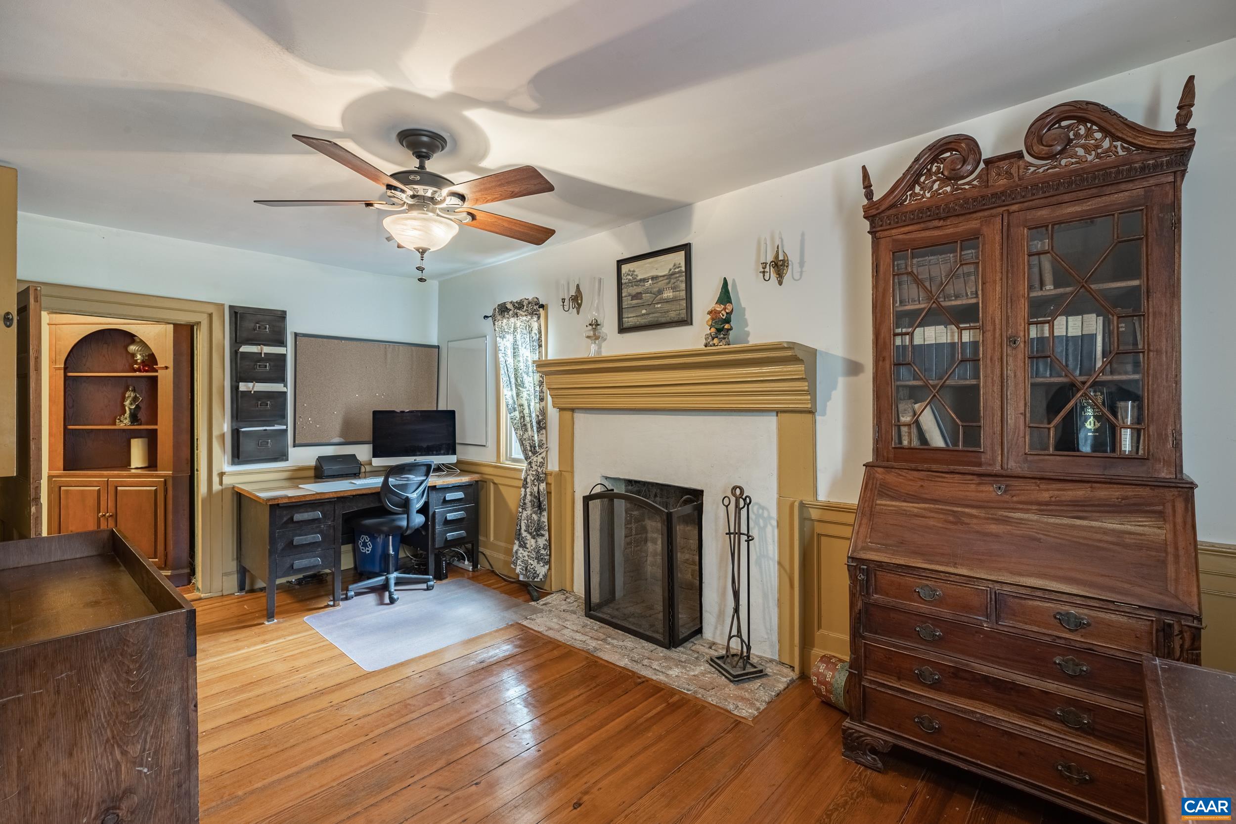 3100 Bacon School Road Saxe, VA 23967 - Photo 28 of 47 a living room with furniture a fireplace and wooden floor