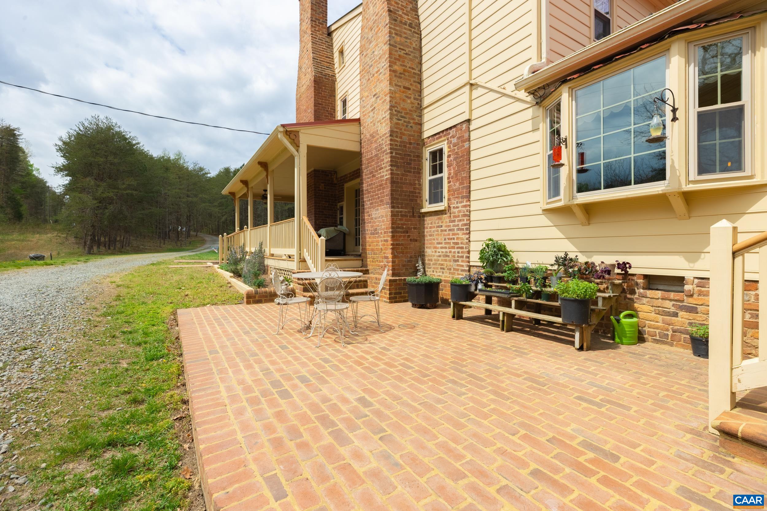 3100 Bacon School Road Saxe, VA 23967 - Photo 35 of 47 a view of a house with backyard and sitting area