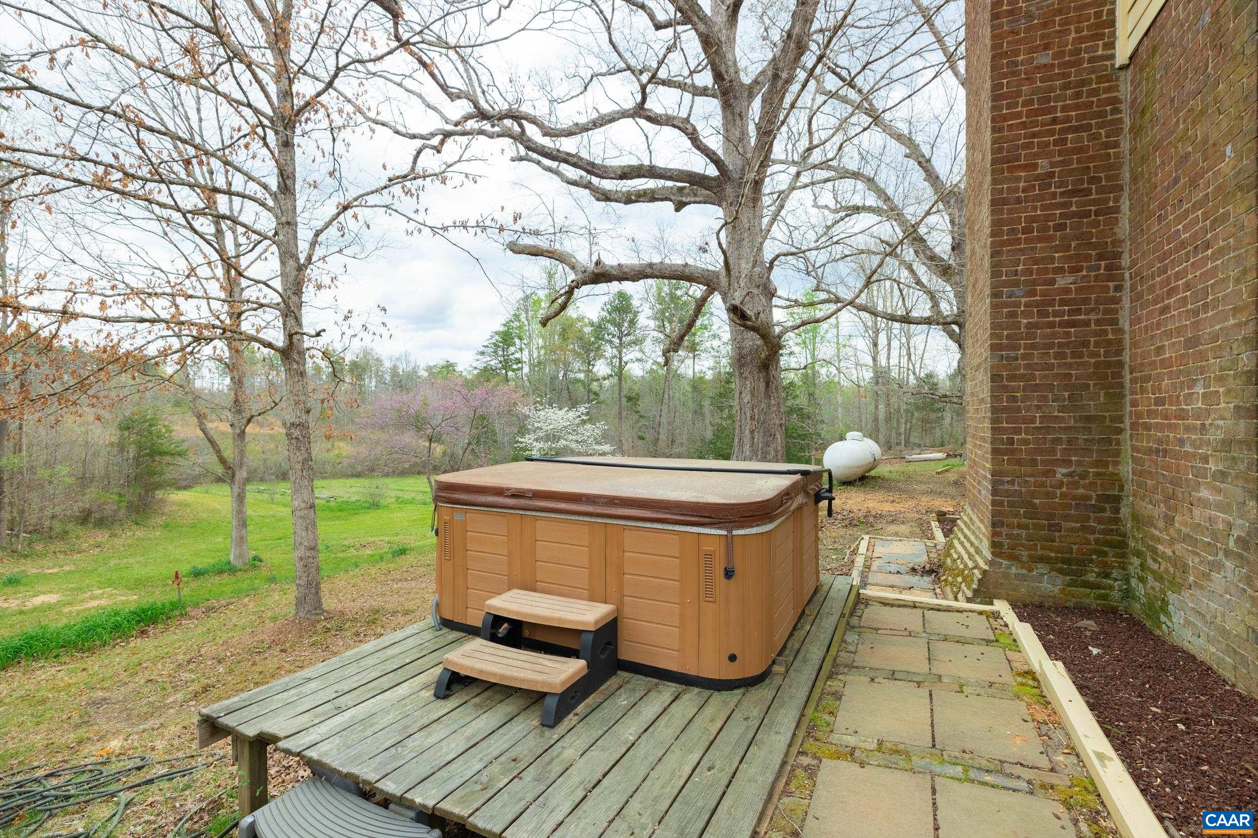 3100 Bacon School Road Saxe, VA 23967 - Photo 37 of 47 a backyard of a house with table and chairs