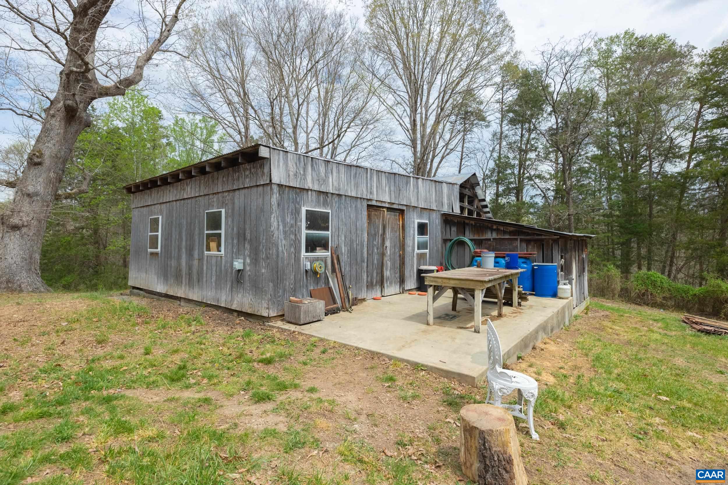 3100 Bacon School Road Saxe, VA 23967 - Photo 38 of 47 a view of a house with backyard and sitting area