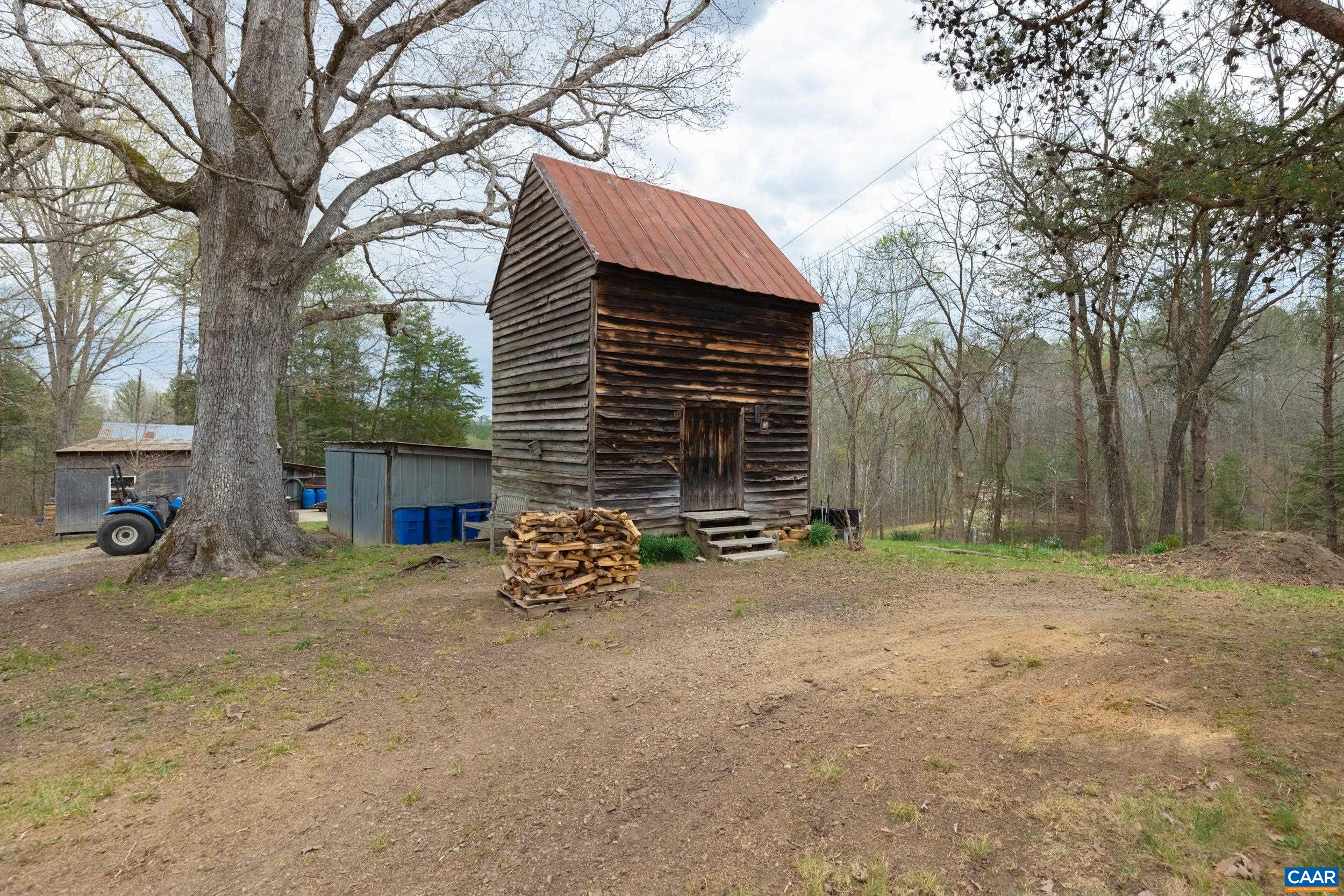 3100 Bacon School Road Saxe, VA 23967 - Photo 39 of 47 a view of a house with a yard and a large tree