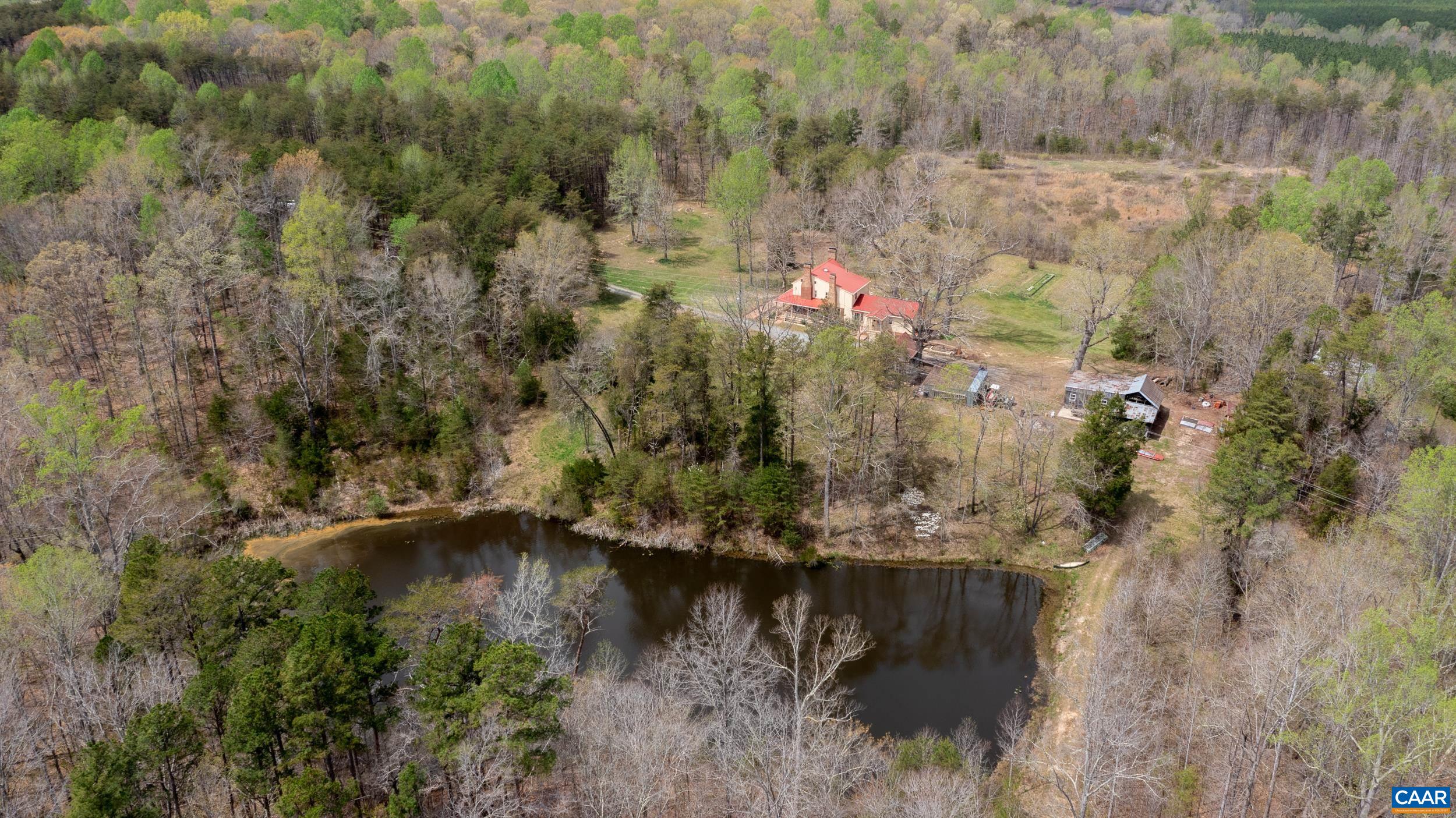3100 Bacon School Road Saxe, VA 23967 - Photo 42 of 47 a view of a lake with a yard and trees