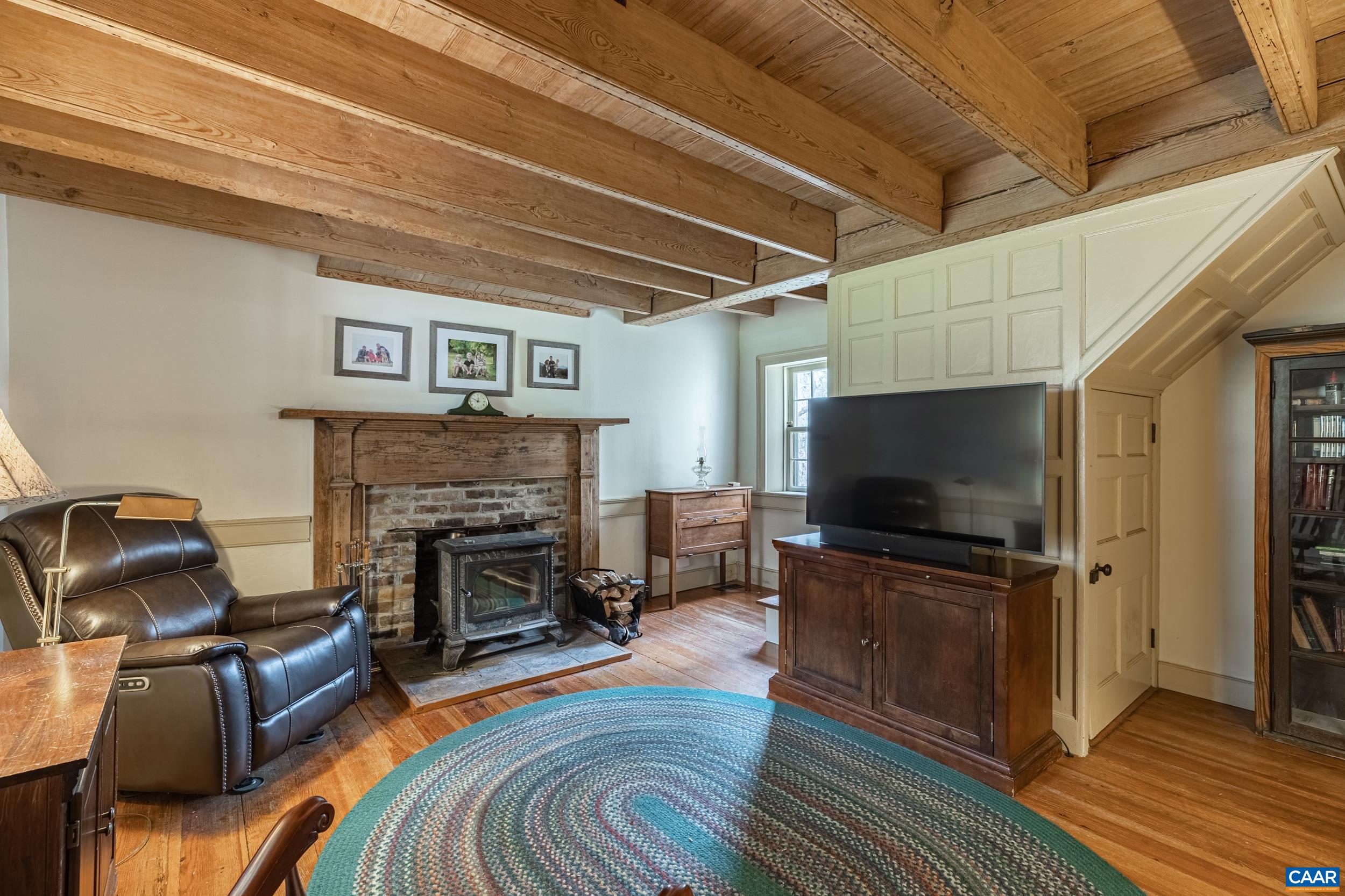 3100 Bacon School Road Saxe, VA 23967 - Photo 6 of 47 a living room with furniture and a flat screen tv