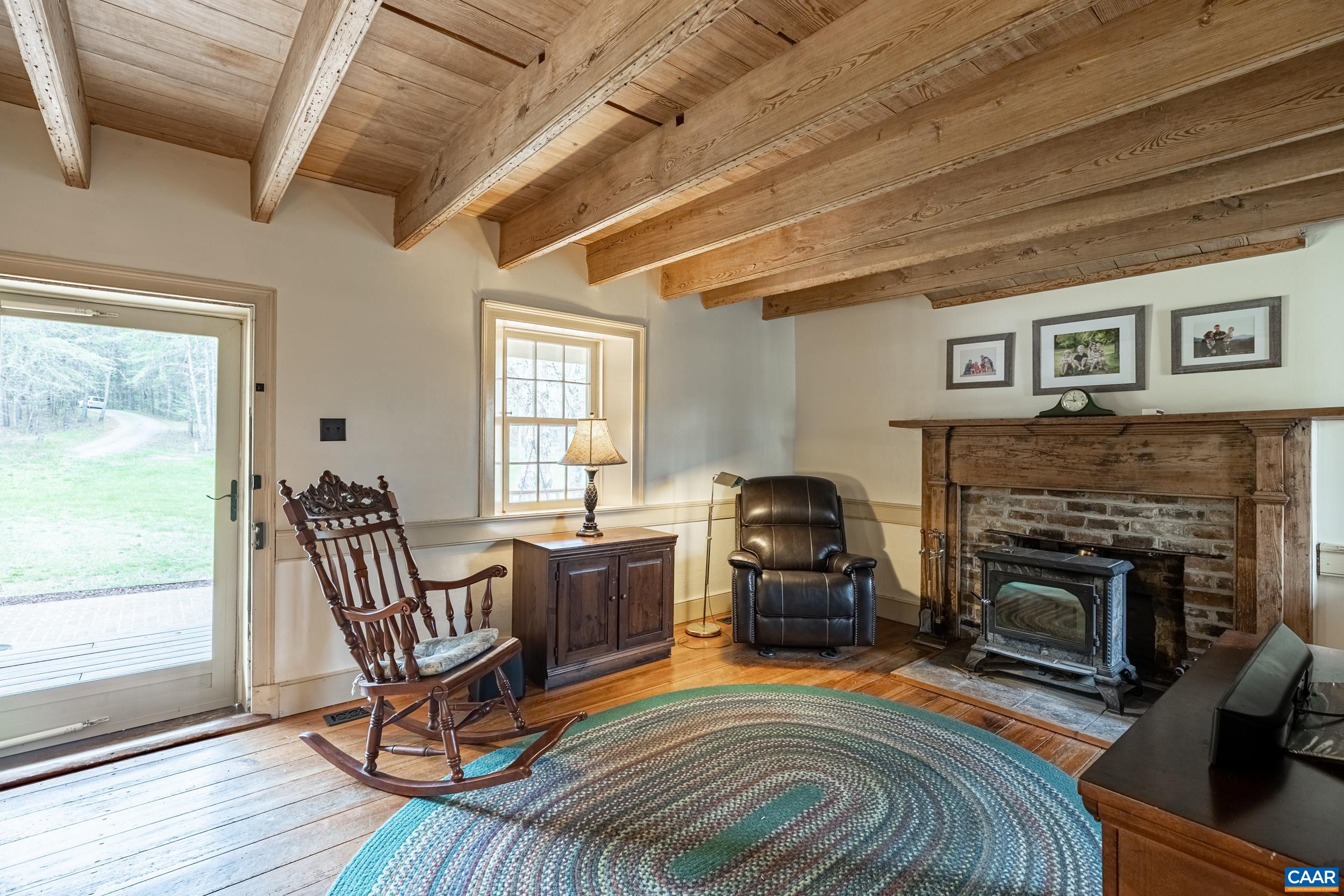 3100 Bacon School Road Saxe, VA 23967 - Photo 7 of 47 a living room with furniture and a fireplace