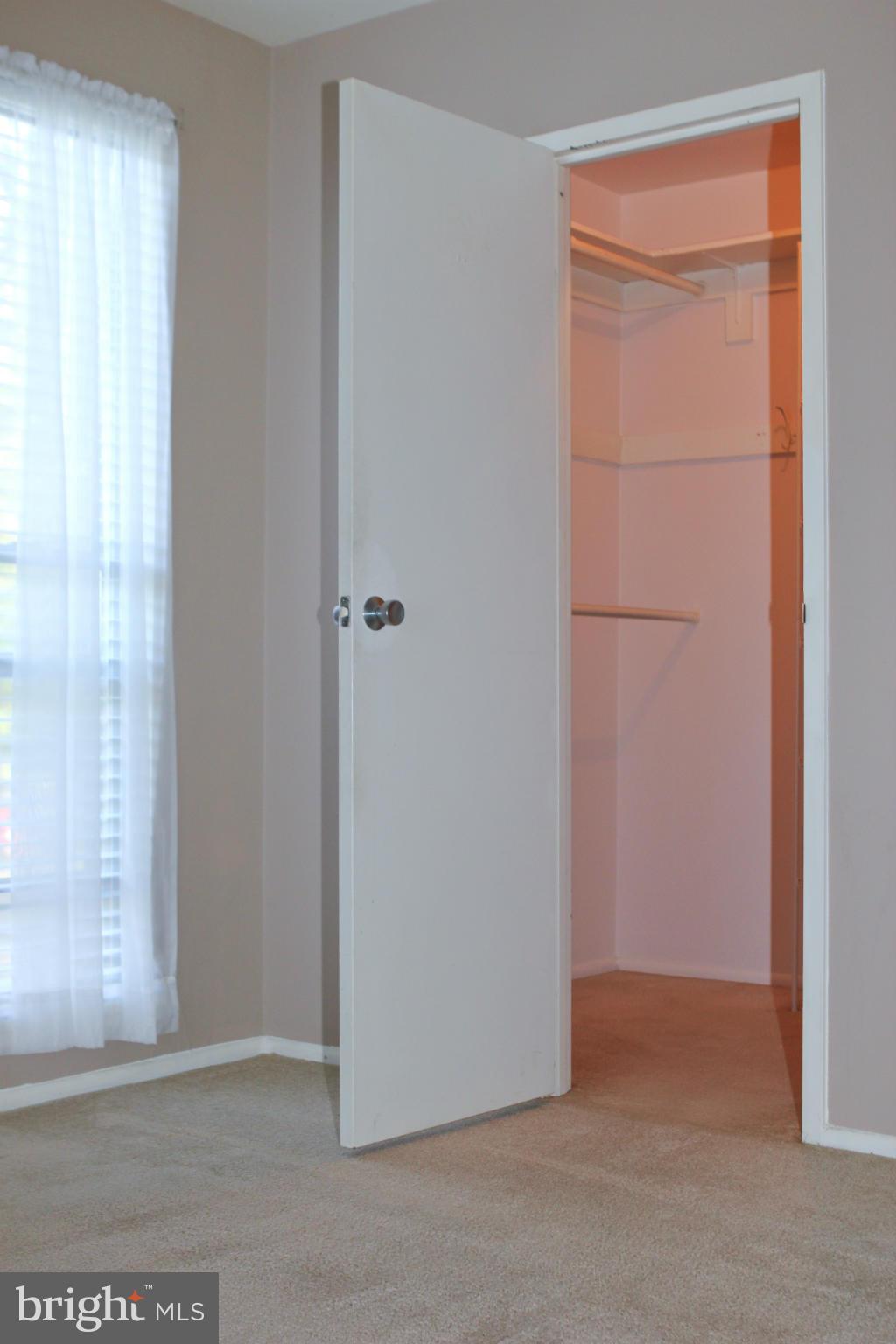 2010 Colts Neck Road, Unit 21B Reston, VA 20191 - Photo 14 of 25 a view of an empty room and closet area
