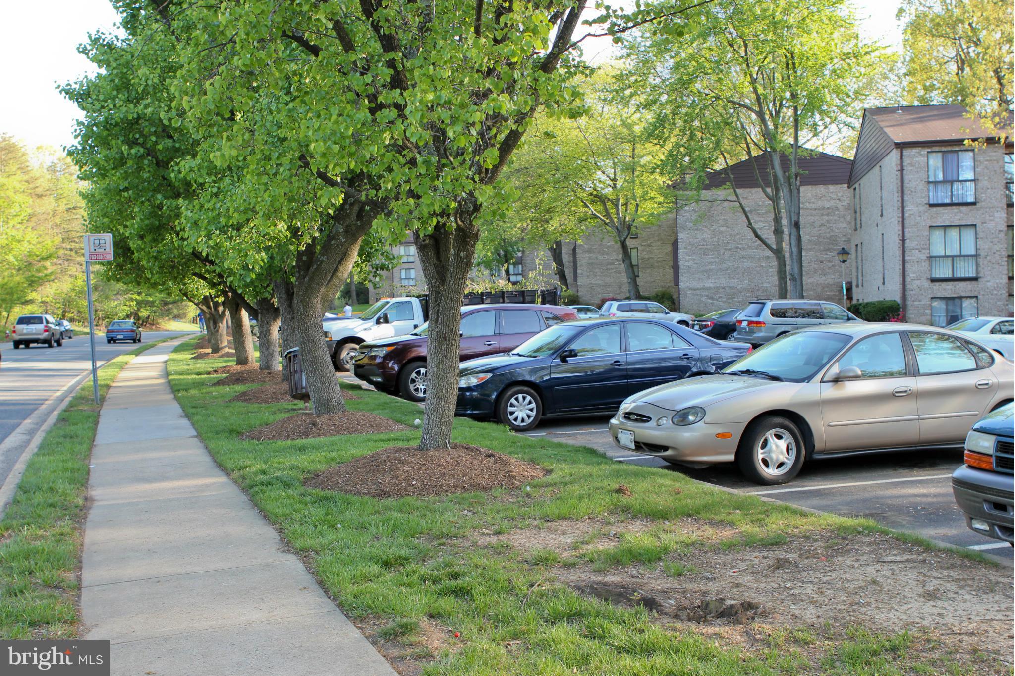 2010 Colts Neck Road, Unit 21B Reston, VA 20191 - Photo 22 of 25 a front view of a house with cars parked