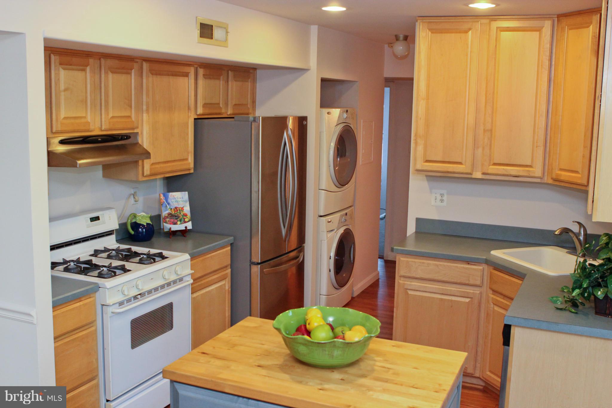 2010 Colts Neck Road, Unit 21B Reston, VA 20191 - Photo 4 of 25 a kitchen with stainless steel appliances granite countertop a refrigerator a sink a stove and a cabinets