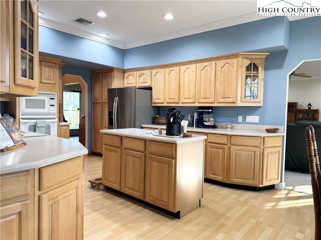 175 Olive Ridge Drive Crumpler, NC 28617 - Photo 21 of 50 a kitchen with granite countertop a sink stainless steel appliances and cabinets