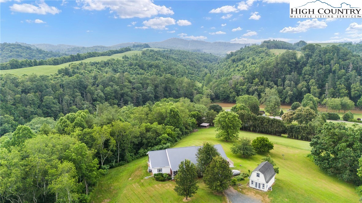175 Olive Ridge Drive Crumpler, NC 28617 - Photo 42 of 50 a view of a lake with houses