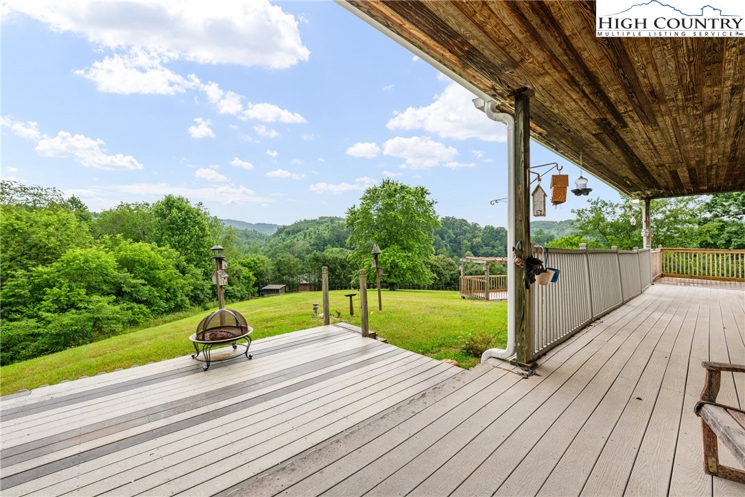 175 Olive Ridge Drive Crumpler, NC 28617 - Photo 45 of 50 a view of swimming pool with a patio and a yard
