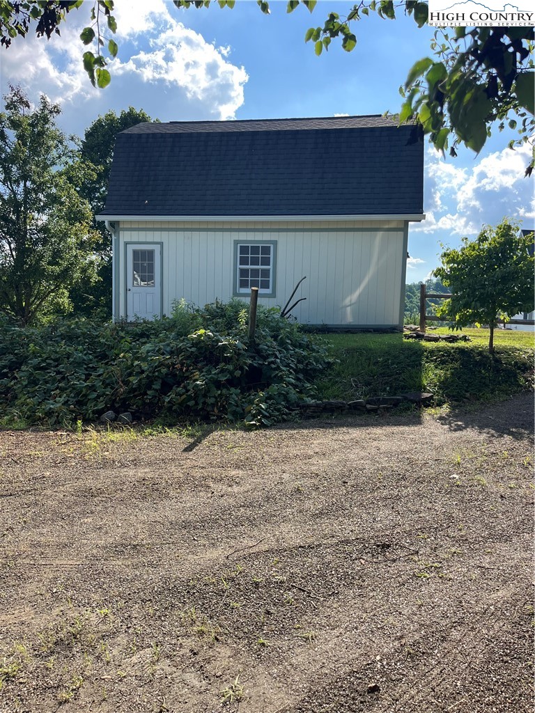 175 Olive Ridge Drive Crumpler, NC 28617 - Photo 49 of 50 a front view of a house with garden