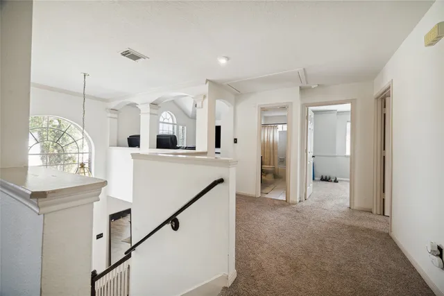 a view of a kitchen cabinets and chandelier