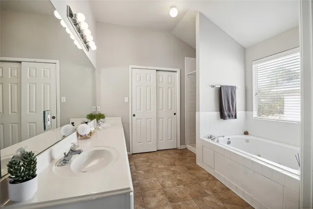 a bathroom with a bathtub and a sink